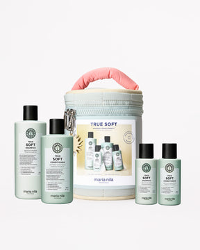 Maria Nila hair care products including bottles and a travel case on a white background