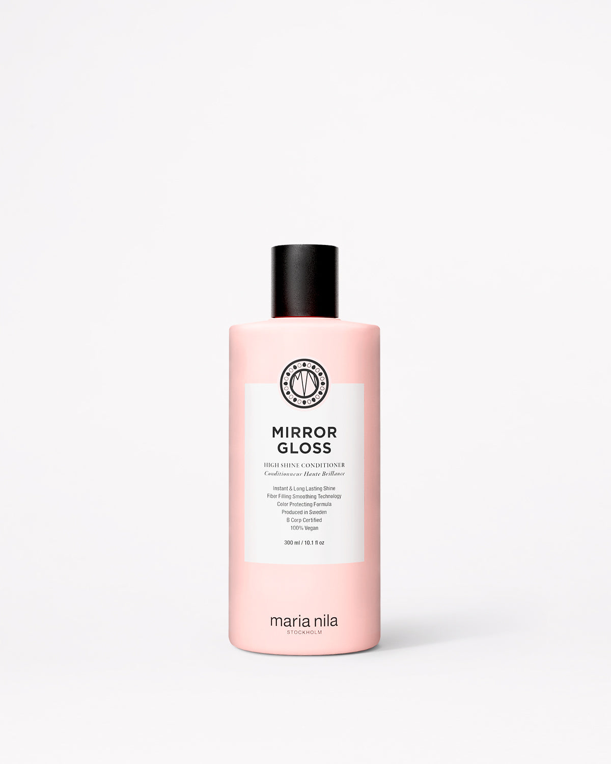 A bottle of Maria Nila Mirror Gloss Conditioner in a pale pink bottle with a black cap and white label, centered on a light gray background.