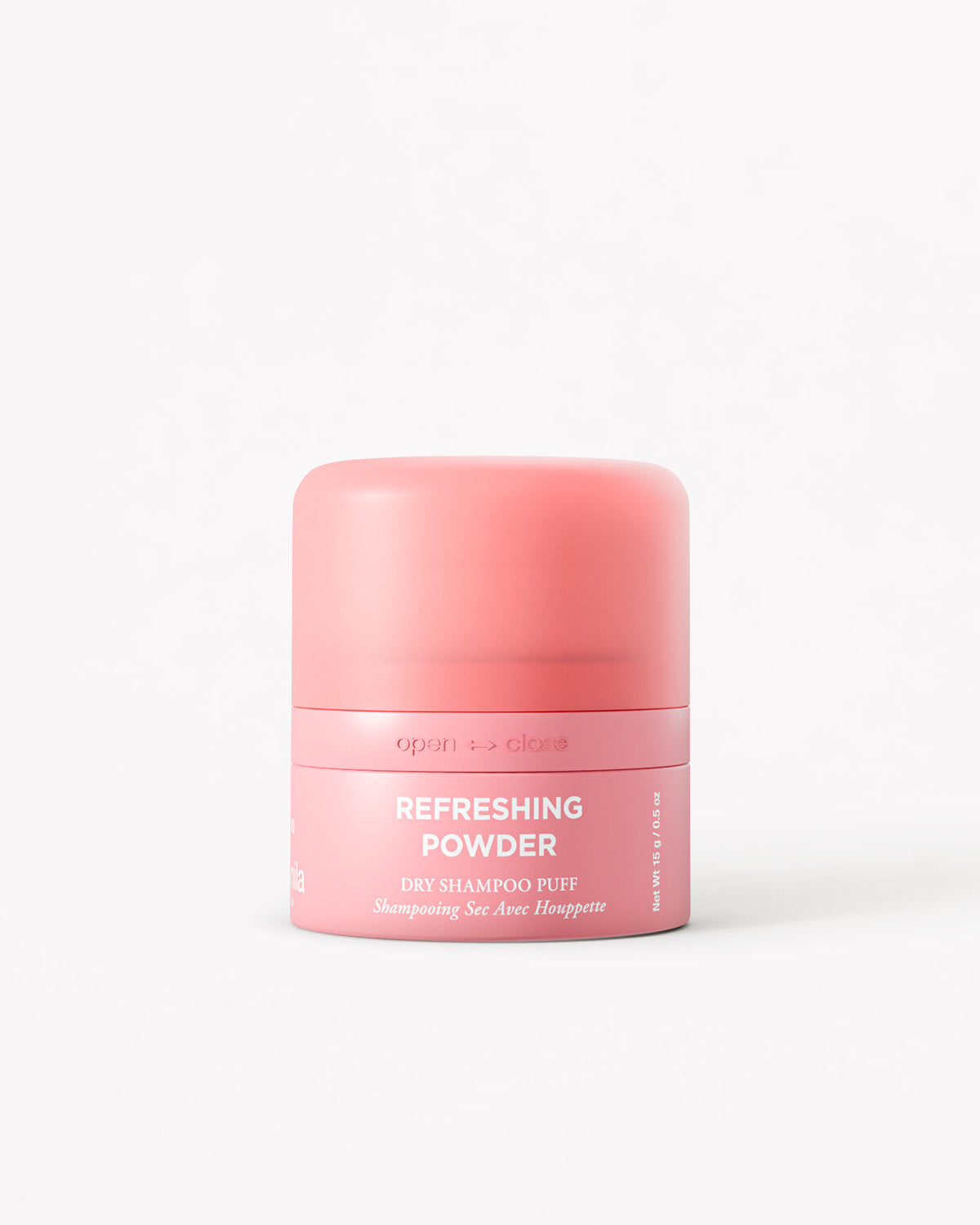 A pink cylindrical jar of Refreshing Powder Dry Shampoo on a clean white background.