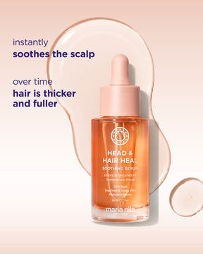 Maria Nila Head & Hair Heal Soothing Serum in a clear glass dropper bottle with a pink cap, set against a soft peach background with a liquid droplet graphic and promotional text.
