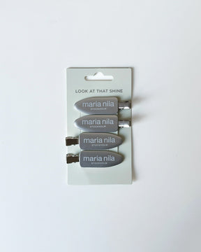 Set of four silver hair clips